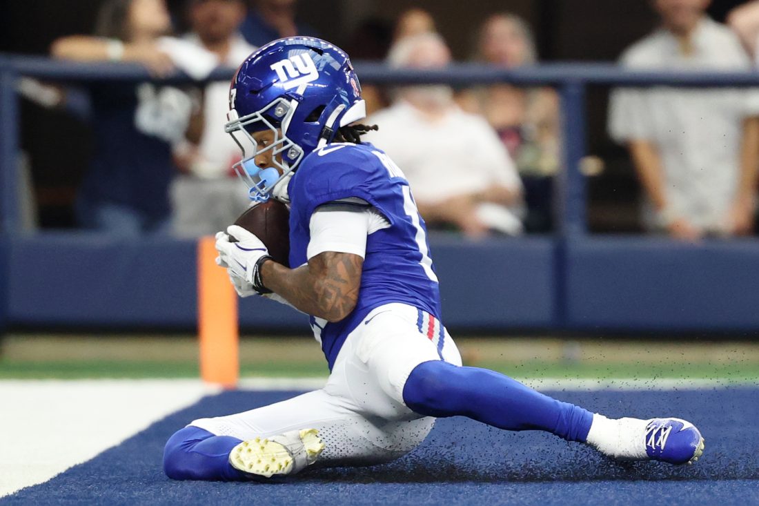 Sep 14, 2025; Arlington, Texas, USA; New York Giants wide receiver Wan'Dale Robinson (17) makes a catch for a touchdown against the New York Giants during the fourth quarter at AT&T Stadium. Mandatory Credit: Kevin Jairaj-Imagn Images