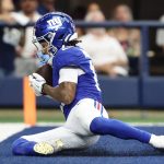 Sep 14, 2025; Arlington, Texas, USA; New York Giants wide receiver Wan'Dale Robinson (17) makes a catch for a touchdown against the New York Giants during the fourth quarter at AT&T Stadium. Mandatory Credit: Kevin Jairaj-Imagn Images