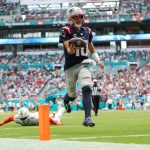 Sep 14, 2025; Miami Gardens, Florida, USA; New England Patriots quarterback Drake Maye (10) runs into the endzone for a touchdown against the Miami Dolphins in the third quarter at Hard Rock Stadium. Mandatory Credit: Nathan Ray Seebeck-Imagn Images
