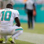 Sep 14, 2025; Miami Gardens, Florida, USA; Miami Dolphins wide receiver Tyreek Hill (10) watches from the sideline against the New England Patriots during the fourth quarter at Hard Rock Stadium. Mandatory Credit: Sam Navarro-Imagn Images
