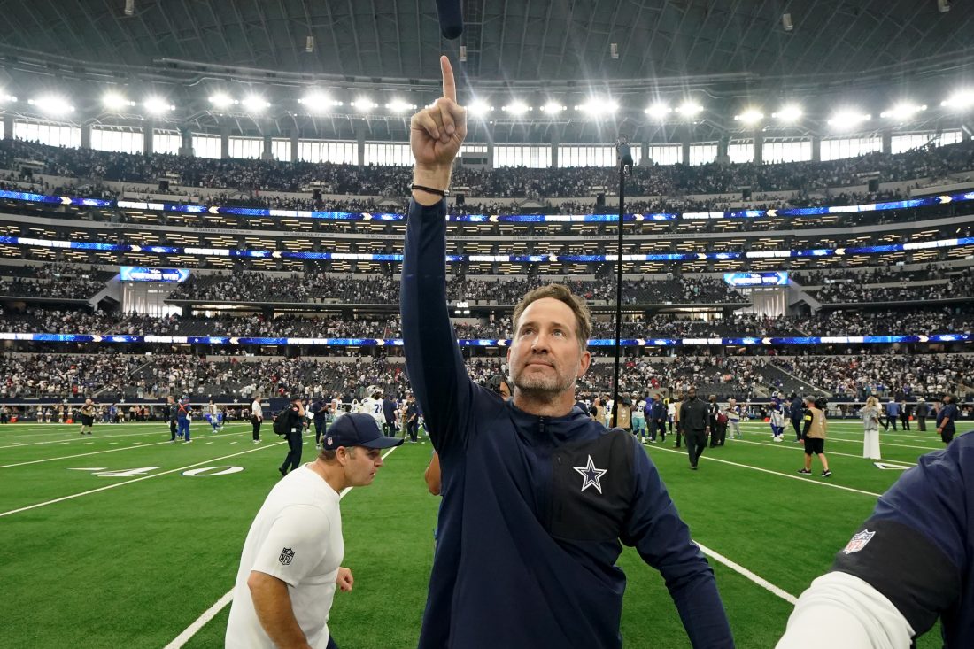 Sep 14, 2025; Arlington, Texas, USA; Dallas Cowboys head coach Brian Schottenheimer gestures to fans after the game against the New York Giants at AT&T Stadium.