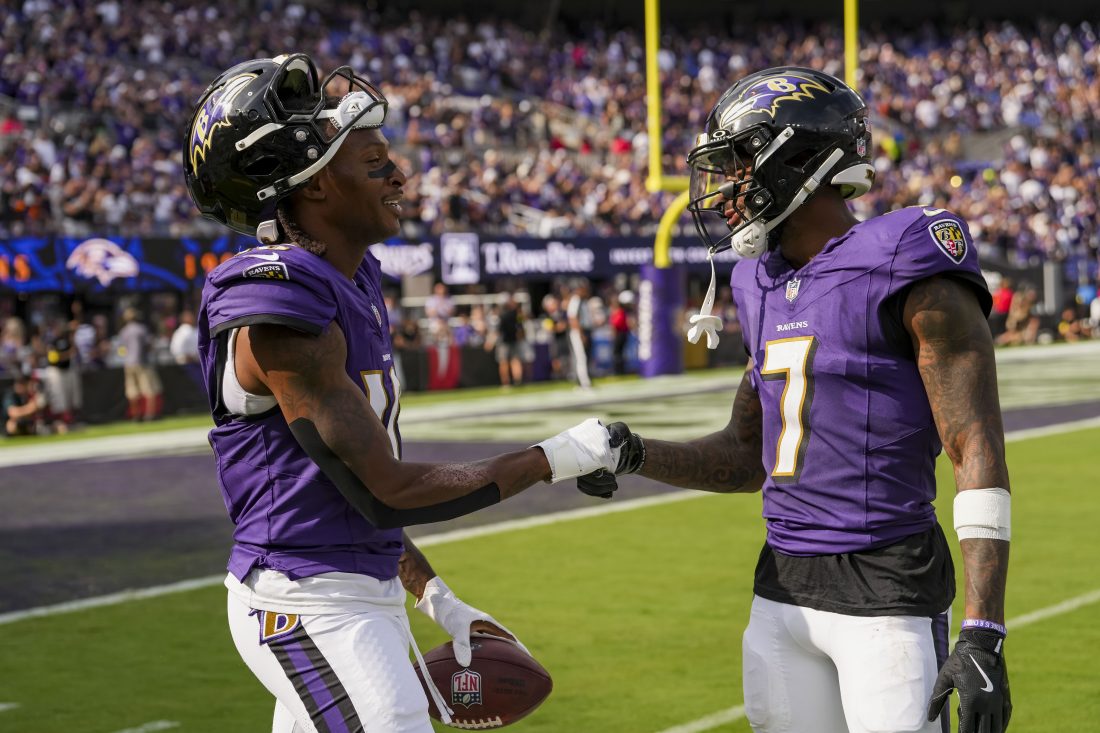 Sep 14, 2025; Baltimore, Maryland, USA; Baltimore Ravens wide receiver DeAndre Hopkins (10) shakes hands with Baltimore Ravens wide receiver Rashod Bateman (7) after making a catch for a touchdown during the fourth quarter at M&T Bank Stadium. Mandatory Credit: Mitch Stringer-Imagn Images