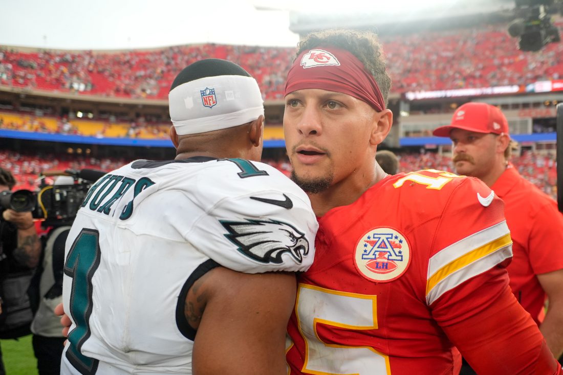 Sep 14, 2025; Kansas City, Missouri, USA; Philadelphia Eagles quarterback Jalen Hurts (1) and Kansas City Chiefs quarterback Patrick Mahomes (15) greet eachother after the game at GEHA Field at Arrowhead Stadium.