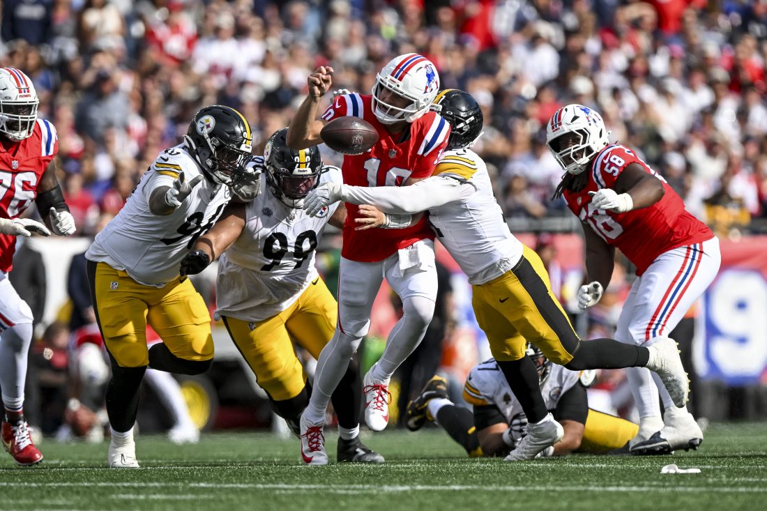 Sep 21, 2025; Foxborough, Massachusetts, USA; New England Patriots quarterback Drake Maye (10) fumbles the ball during the fourth quarter at Gillette Stadium. Mandatory Credit: Brian Fluharty-Imagn Images