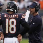 Sep 21, 2025; Chicago, Illinois, USA; Chicago Bears head coach Ben Johnson talks with quarterback Caleb Williams (18) against the Dallas Cowboys during the second half at Soldier Field.