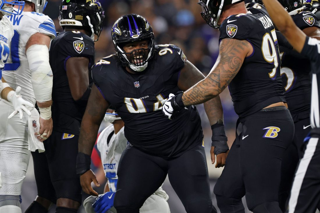 Sep 22, 2025; Baltimore, Maryland, USA; Baltimore Ravens defensive tackle John Jenkins (94) reacts after a play against the Detroit Lions during the first half at M&T Bank Stadium.