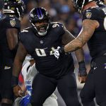 Sep 22, 2025; Baltimore, Maryland, USA; Baltimore Ravens defensive tackle John Jenkins (94) reacts after a play against the Detroit Lions during the first half at M&T Bank Stadium.