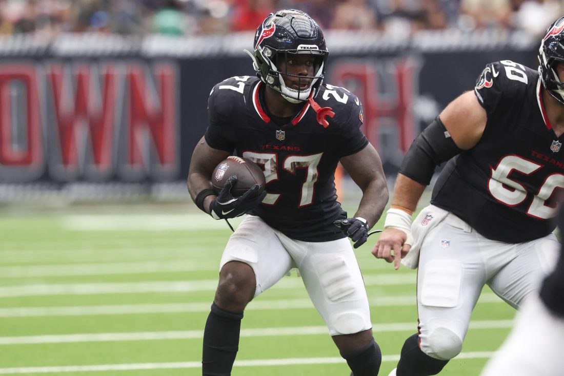 Sep 28, 2025; Houston, Texas, USA; Houston Texans running back Woody Marks (27) runs with the ball during the fourth quarter against the Tennessee Titans at NRG Stadium. Mandatory Credit: Troy Taormina-Imagn Images