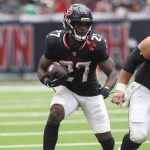 Sep 28, 2025; Houston, Texas, USA; Houston Texans running back Woody Marks (27) runs with the ball during the fourth quarter against the Tennessee Titans at NRG Stadium. Mandatory Credit: Troy Taormina-Imagn Images