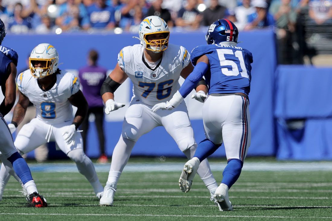 Sep 28, 2025; East Rutherford, New Jersey, USA; Los Angeles Chargers offensive tackle Joe Alt (76) blocks against New York Giants linebacker Abdul Carter (51) during the first quarter at MetLife Stadium. Mandatory Credit: Brad Penner-Imagn Images