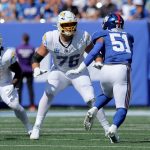 Sep 28, 2025; East Rutherford, New Jersey, USA; Los Angeles Chargers offensive tackle Joe Alt (76) blocks against New York Giants linebacker Abdul Carter (51) during the first quarter at MetLife Stadium. Mandatory Credit: Brad Penner-Imagn Images