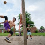 Ma Ling kicks the ball while playing sepak takraw Sunday, May 14, 2023, with friends on a dirt court in Southport. Sepak takraw brings the Burmese American community closer together in Indianapolis as they play the national sport of Burma.