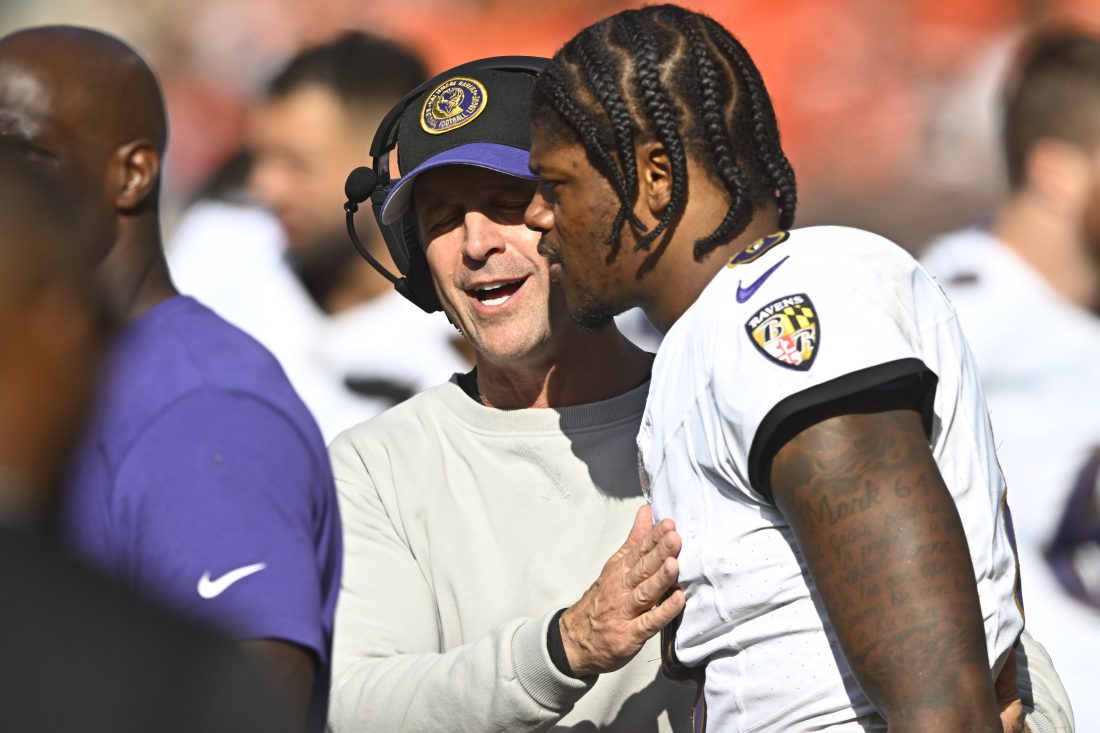 Oct 1, 2023; Cleveland, Ohio, USA; Baltimore Ravens head coach John Harbaugh talks with quarterback Lamar Jackson (8) in the fourth quarter against the Cleveland Browns at Cleveland Browns Stadium. Mandatory Credit: David Richard-USA TODAY Sports