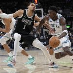 Jan 27, 2024; San Antonio, Texas, USA; Minnesota Timberwolves guard Anthony Edwards (5) drives to the basket against San Antonio Spurs forward Victor Wembanyama (1) during the second half at Frost Bank Center. Mandatory Credit: Scott Wachter-USA TODAY Sports