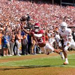 Oklahoma Sooners wide receiver J.J. Hester (13) can not make a catch as Texas Longhorns defensive back Malik Muhammad (5) defends in the first half of the Red River Rivalry college football game between the University of Oklahoma Sooners and the Texas Longhorn at the Cotton Bowl Stadium in Dallas, Texas, Saturday, Oct., 12, 2024.