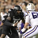 Oct 26, 2024; College Station, Texas, USA; Texas A&M Aggies defensive lineman Nic Scourton (11) defends in coverage against LSU Tigers offensive tackle Will Campbell (66) during the fourth quarter. The Aggies defeated the Tigers 38-23; at Kyle Field. Mandatory Credit: Maria Lysaker-Imagn Images.