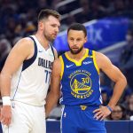 Dec 15, 2024; San Francisco, California, USA; Dallas Mavericks guard Luka Doncic (77) talks to Golden State Warriors guard Stephen Curry (30) during the first quarter at Chase Center. Mandatory Credit: Darren Yamashita-Imagn Images