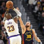 Jan 25, 2025; San Francisco, California, USA; Golden State Warriors guard Stephen Curry (30) defends against Los Angeles Lakers forward LeBron James (23) during the fourth quarter at Chase Center.