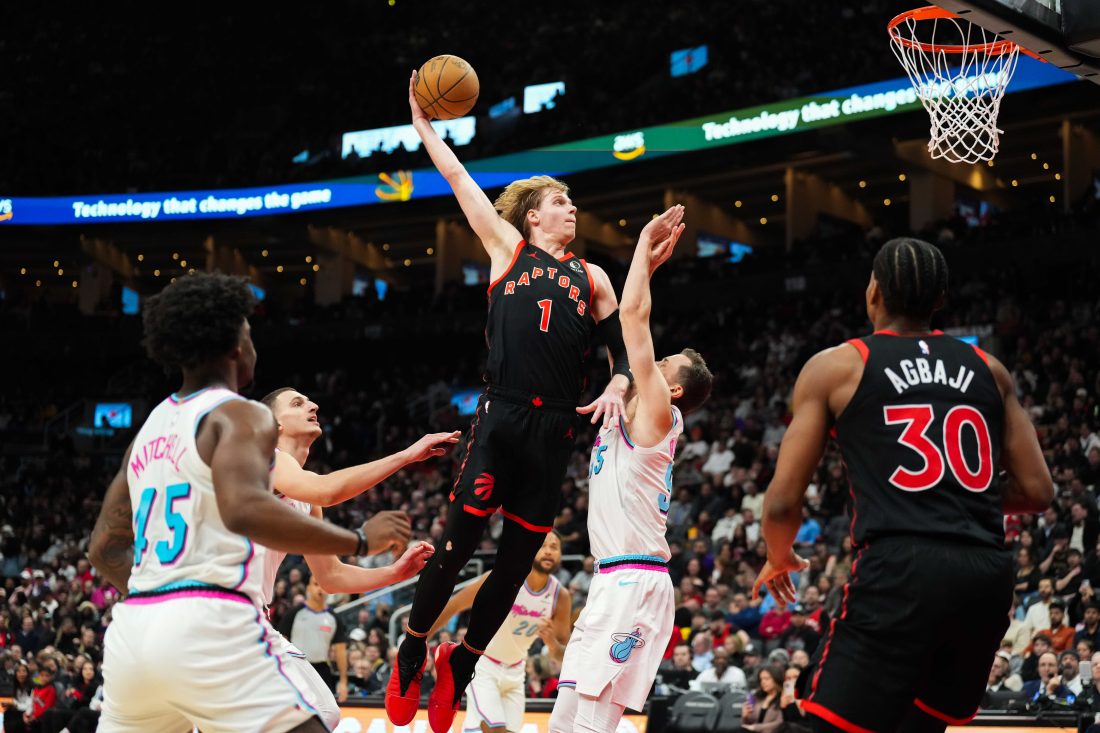 Feb 21, 2025; Toronto, Ontario, CAN; Toronto Raptors guard Gradey Dick (1) drives to the net against Miami Heat forward Duncan Robinson (55) at Scotiabank Arena. Mandatory Credit: Kevin Sousa-Imagn Images