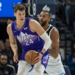 Mar 16, 2025; Minneapolis, Minnesota, USA; Utah Jazz center Walker Kessler (24) backs towards the basket as Minnesota Timberwolves center Rudy Gobert (27) plays defense in the first half at Target Center. Mandatory Credit: Jesse Johnson-Imagn Images