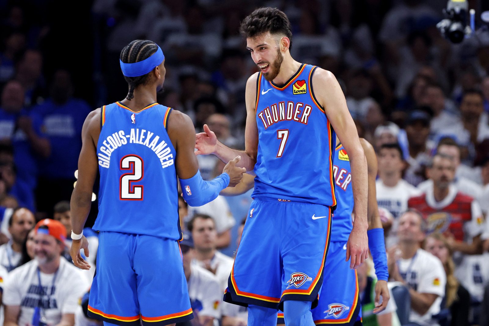 May 28, 2025; Oklahoma City, Oklahoma, USA; Oklahoma City Thunder forward Chet Holmgren (7) and guard Shai Gilgeous-Alexander (2) celebrates during the second quarter against the Minnesota Timberwolves in game five of the western conference finals for the 2025 NBA Playoffs at Paycom Center. Mandatory Credit: Alonzo Adams-Imagn Images