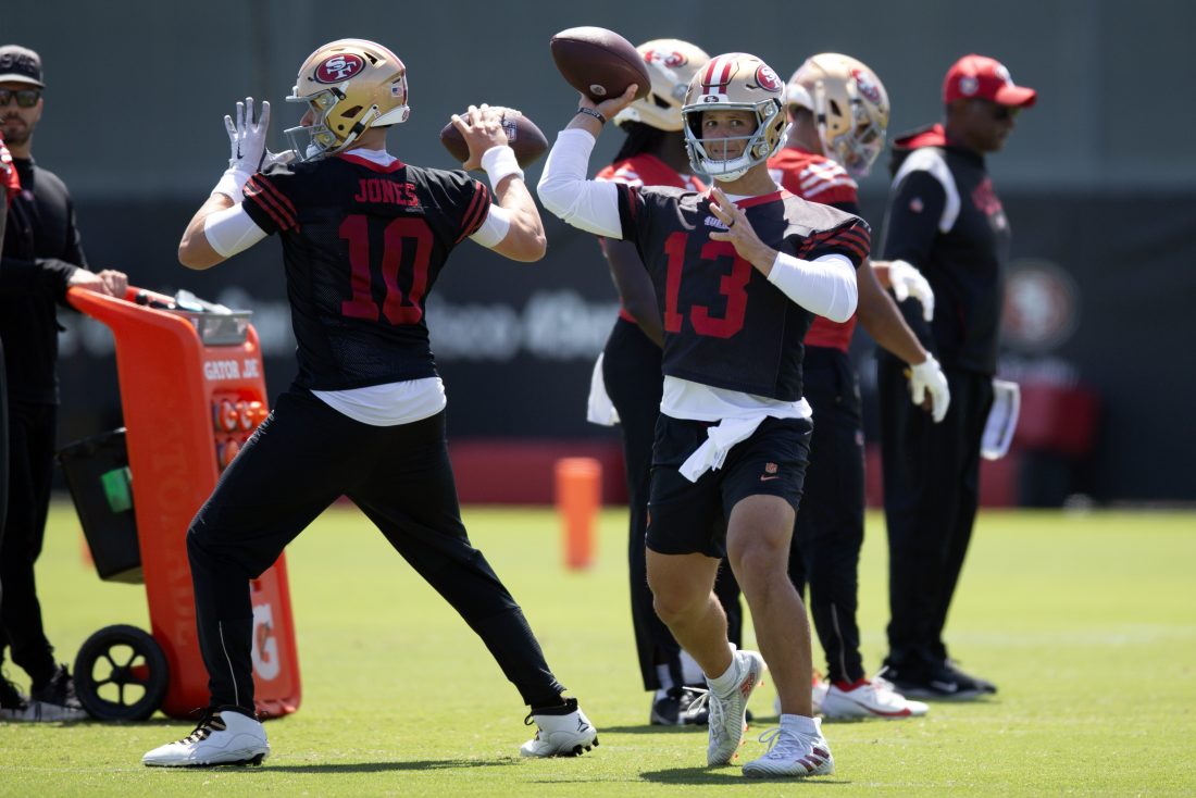 Jun 11, 2025; Santa Clara, CA, USA; San Francisco 49ers quarterbacks Mac Jones (10) and Brock Purdy (13) work on passing drills during a team OTA at Levi's Stadium. Mandatory Credit: D. Ross Cameron-Imagn Images