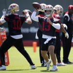 Jun 11, 2025; Santa Clara, CA, USA; San Francisco 49ers quarterbacks Mac Jones (10) and Brock Purdy (13) work on passing drills during a team OTA at Levi's Stadium. Mandatory Credit: D. Ross Cameron-Imagn Images