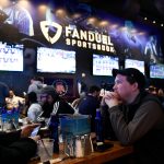 Seamus Magee, right, and Anthony Mea, both of Hoboken, watch the first games of the NCAA basketball tournament at the Meadowlands Racetrack, where sports fans can legally bet on March Madness games for the first time in New Jersey on Thursday, March 21, 2019, in East Rutherford.