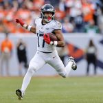 Sep 7, 2025; Denver, Colorado, USA; Tennessee Titans wide receiver Chimere Dike (17) runs with the ball against the Denver Broncos in the first half at Empower Field at Mile High. Mandatory Credit: Isaiah J. Downing-Imagn Images