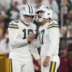 Sep 11, 2025; Green Bay, Wisconsin, USA; Green Bay Packers place kicker Brandon McManus (17) reacts with punter Daniel Whelan (19) after a field goal in the fourth quarter against the Washington Commanders at Lambeau Field. Mandatory Credit: Jeff Hanisch-Imagn Images