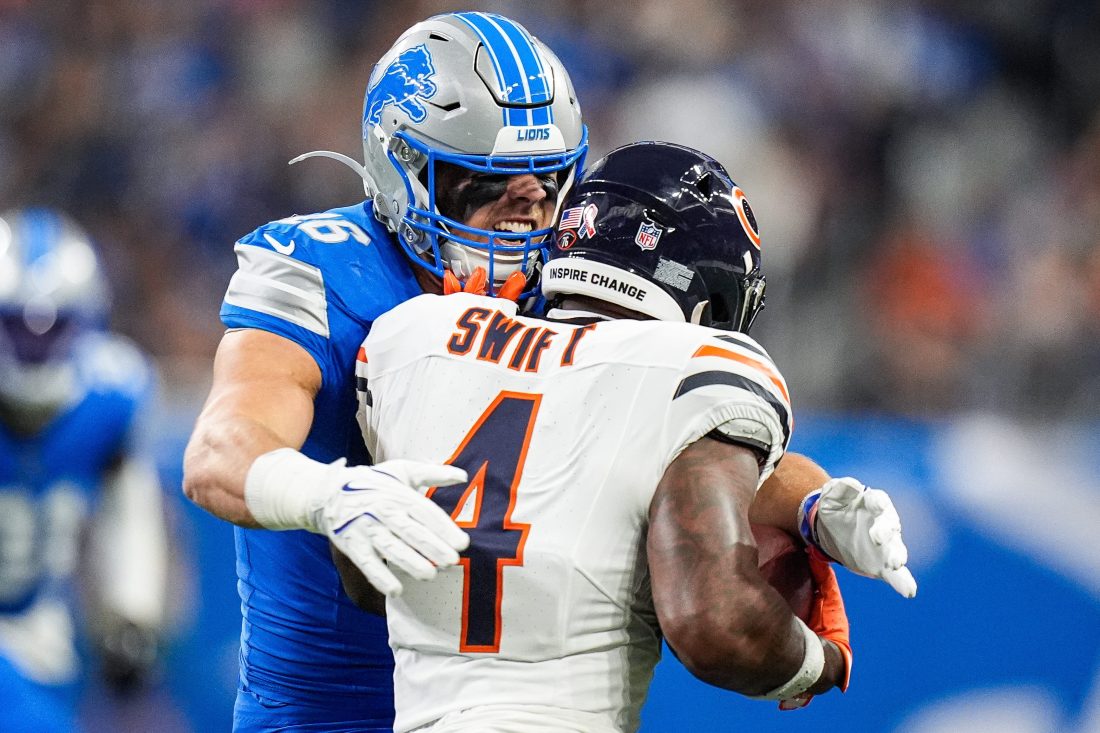 Detroit Lions linebacker Jack Campbell (46) tackles Chicago Bears running back D'Andre Swift (4) during the first half at Ford Field in Detroit on Sunday, Sept. 14, 2025.