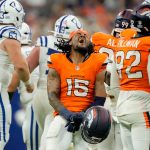 Denver Broncos linebacker Nik Bonitto (15) reacts after a missed field goal by Indianapolis Colts place kicker Spencer Shrader (3) on Sunday, Sept. 14, 2025, during a game at Lucas Oil Stadium in Indianapolis. A penalty on the Broncos game Shrader a second attempt which he made to win the game.