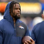 Sep 21, 2025; Inglewood, California, USA; Denver Broncos linebacker Dre Greenlaw (57) on the sidelines prior to the game against the Los Angeles Chargers at SoFi Stadium. Mandatory Credit: Jayne Kamin-Oncea-Imagn Images
