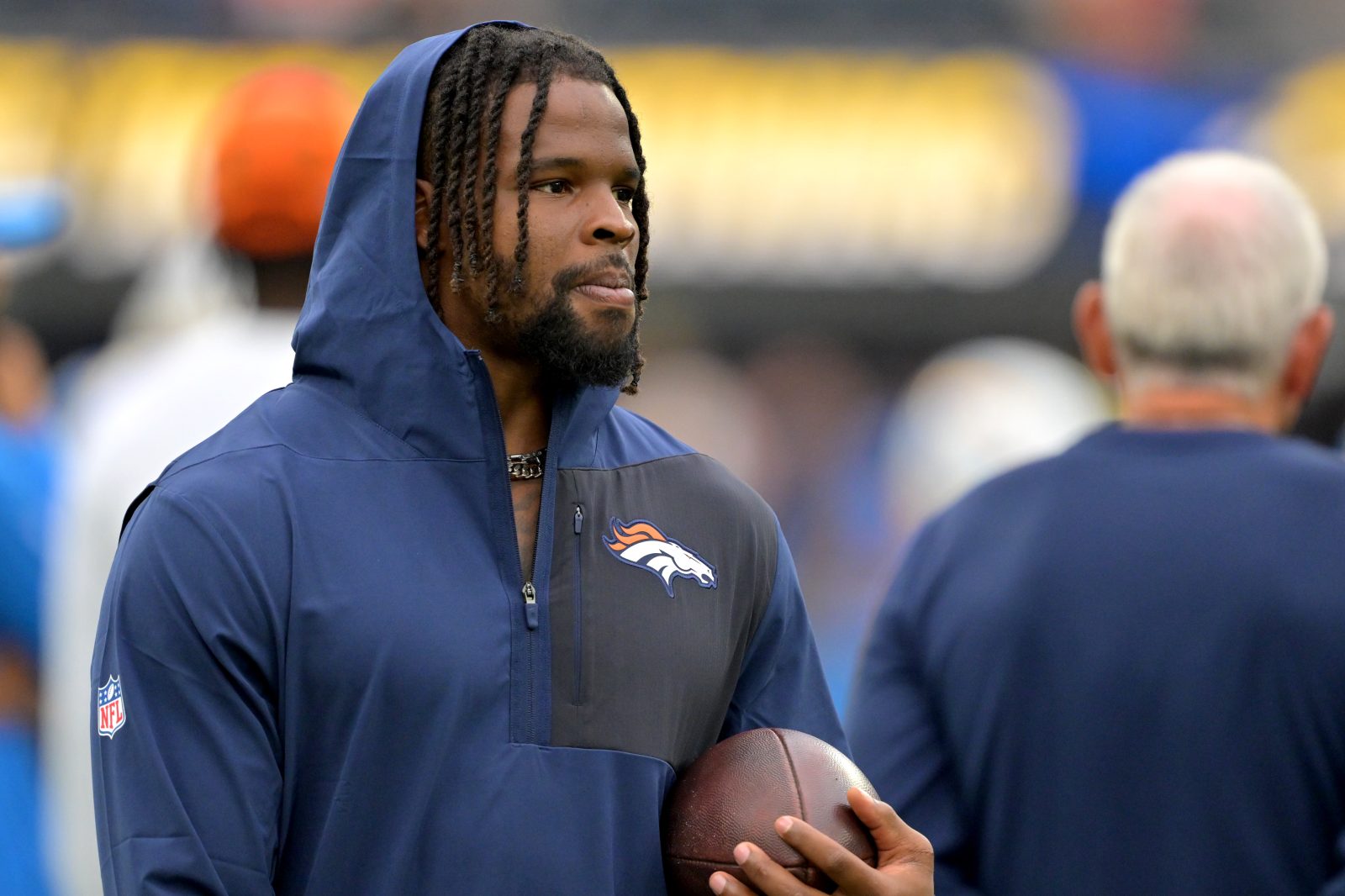 Sep 21, 2025; Inglewood, California, USA; Denver Broncos linebacker Dre Greenlaw (57) on the sidelines prior to the game against the Los Angeles Chargers at SoFi Stadium. Mandatory Credit: Jayne Kamin-Oncea-Imagn Images