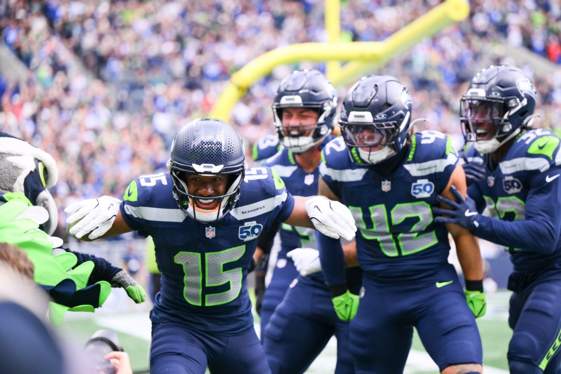 Sep 21, 2025; Seattle, Washington, USA; Seattle Seahawks wide receiver Tory Horton (15) celebrates after scoring a 95 yard punt return for a touchdown against the New Orleans Saints during the first quarter at Lumen Field. Mandatory Credit: Steven Bisig-Imagn Images
