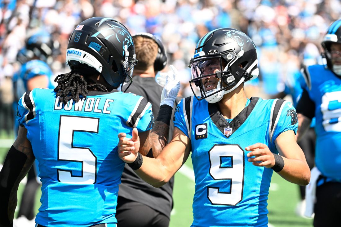 Sep 21, 2025; Charlotte, North Carolina, USA; Carolina Panthers quarterback Bryce Young (9) celebrates with running back Rico Dowdle (5) after scoring a touchdown in the first quarter at Bank of America Stadium. Mandatory Credit: Bob Donnan-Imagn Images