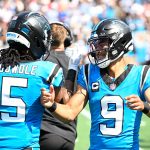 Sep 21, 2025; Charlotte, North Carolina, USA; Carolina Panthers quarterback Bryce Young (9) celebrates with running back Rico Dowdle (5) after scoring a touchdown in the first quarter at Bank of America Stadium. Mandatory Credit: Bob Donnan-Imagn Images