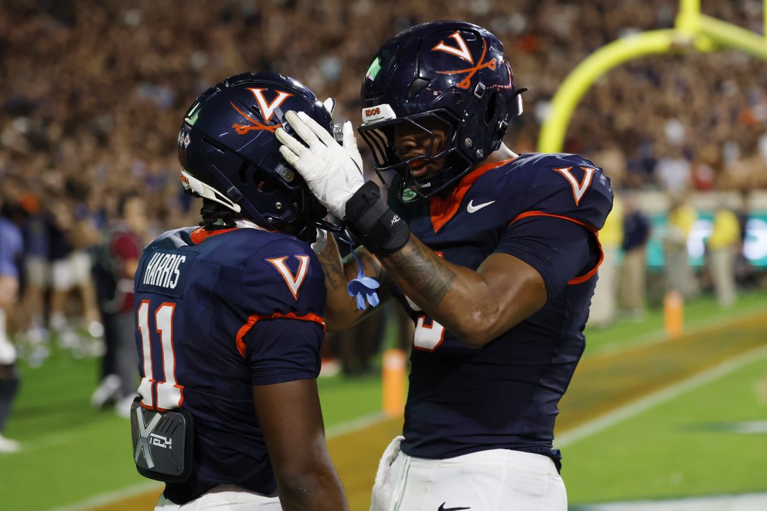 Sep 26, 2025; Charlottesville, Virginia, USA; Virginia Cavaliers wide receiver Trell Harris (11) celebrates with Cavaliers tight end Dakota Twitty (9) after catches a two point conversion as Florida State Seminoles defensive back Jerry Wilson (19) defends in the second overtime period at Scott Stadium. Mandatory Credit: Geoff Burke-Imagn Images