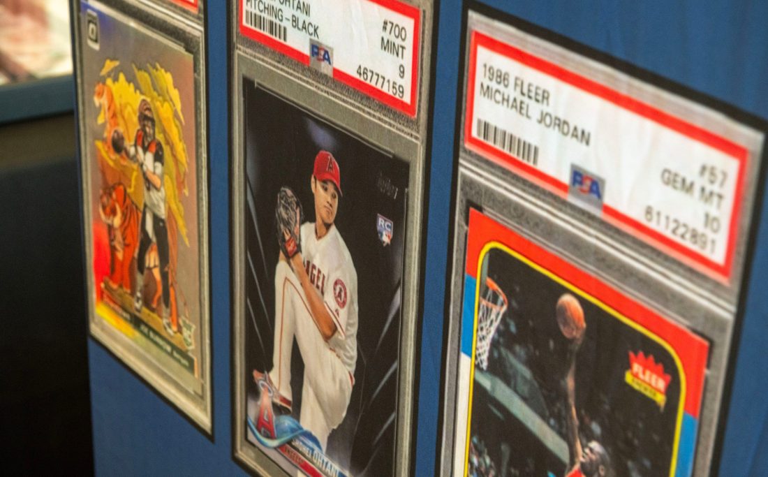 Card collectors check out the items for sale duing Cards on the Coast Sports Card and TCG Show Saturday, Sept. 27, 2025 at Sanders Beach Corrine Jones Resource Center. The show had sports cards, collectable trading card games, food trucks and more.