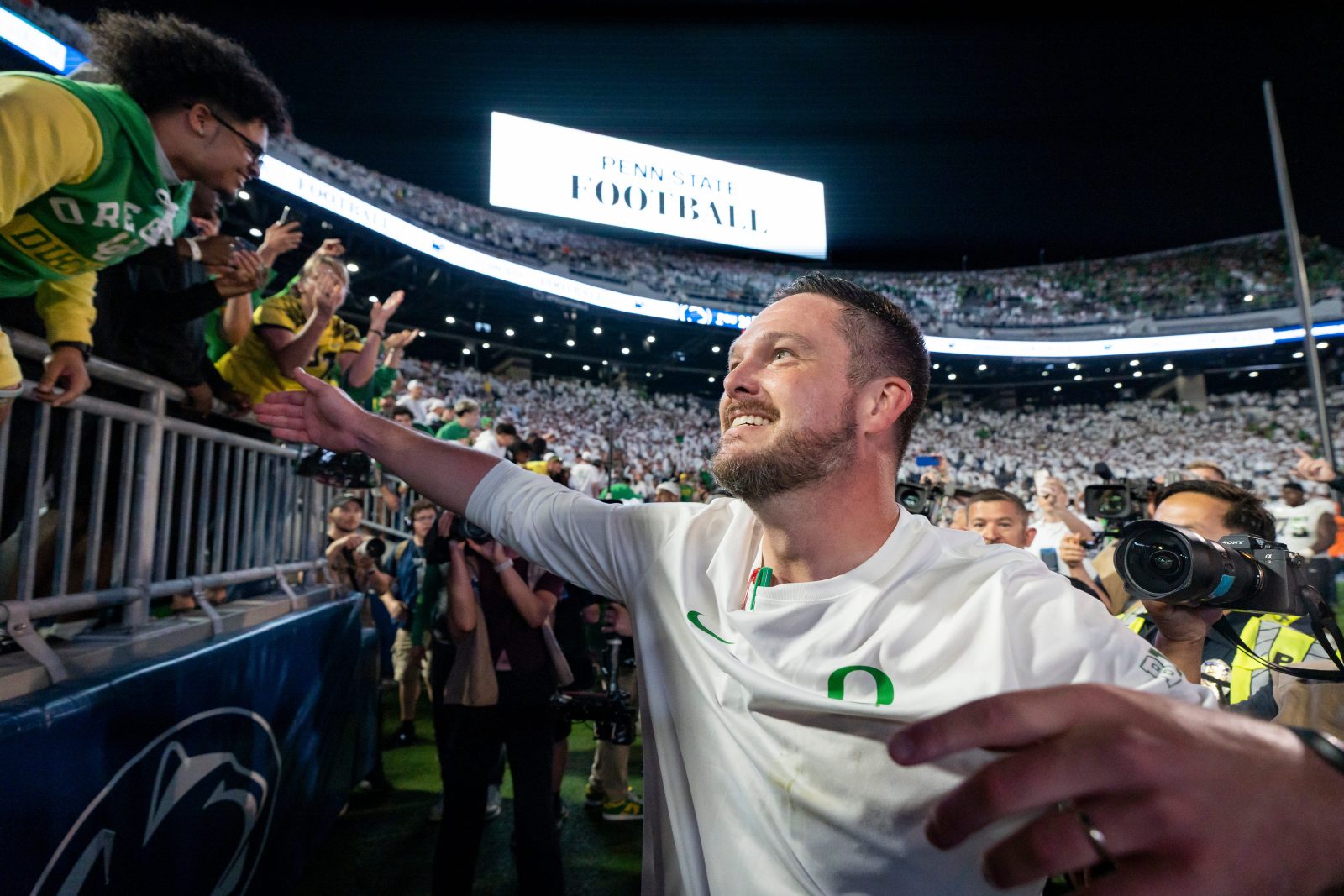 Oregon head coach Dan Lanning celebrates his win with Duck fans as the Oregon Ducks face the Penn State Nittany Lions on Sept. 27, 2025, at Beaver Stadium in University Park, Pennsylvania.
