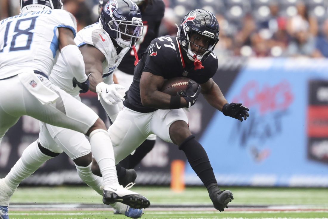 Sep 28, 2025; Houston, Texas, USA; Houston Texans running back Woody Marks (27) runs with the ball during the third quarter against the Tennessee Titans at NRG Stadium.