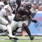 Sep 28, 2025; Houston, Texas, USA; Houston Texans running back Woody Marks (27) runs with the ball during the third quarter against the Tennessee Titans at NRG Stadium.