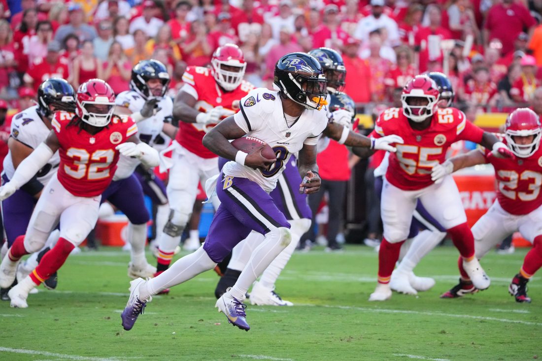 Sep 28, 2025; Kansas City, Missouri, USA; Baltimore Ravens quarterback Lamar Jackson (8) scrambles during the third quarter against the Kansas City Chiefs at GEHA Field at Arrowhead Stadium.