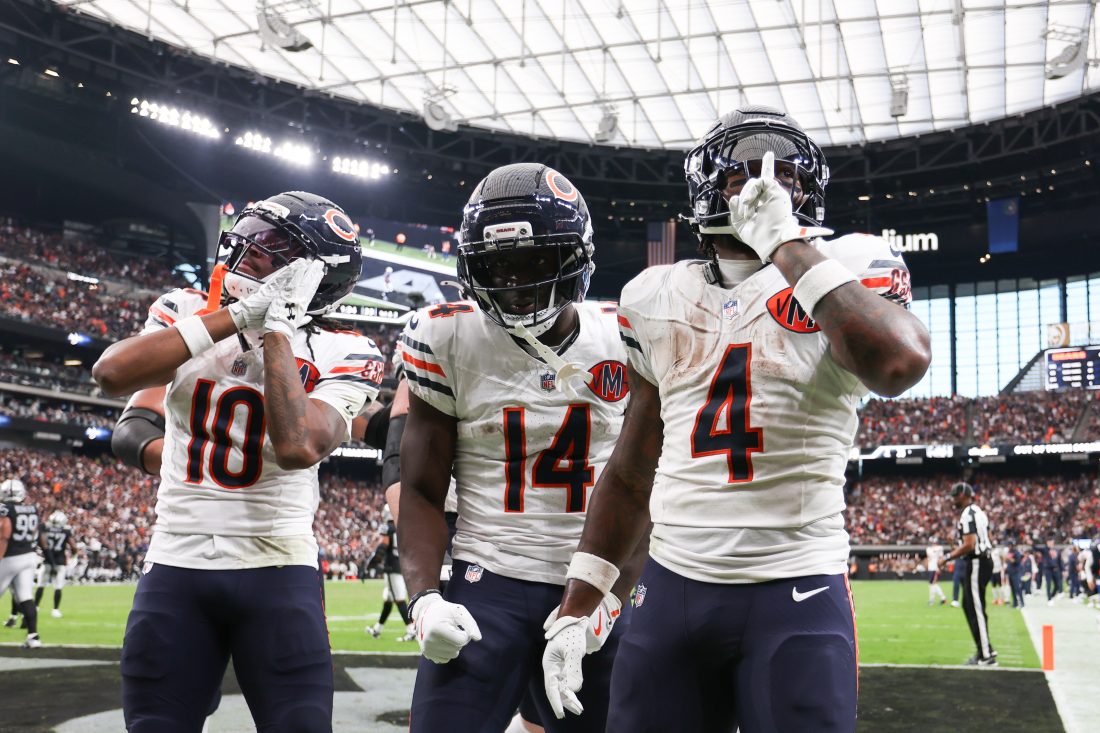 Sep 28, 2025; Paradise, Nevada, USA; Chicago Bears running back d'Andre Swift (4) celebrates a touchdown with wide receiver Olamide Zaccheaus (14) during the second half against the Las Vegas Raiders at Allegiant Stadium.