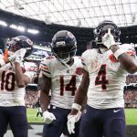 Sep 28, 2025; Paradise, Nevada, USA; Chicago Bears running back d'Andre Swift (4) celebrates a touchdown with wide receiver Olamide Zaccheaus (14) during the second half against the Las Vegas Raiders at Allegiant Stadium.
