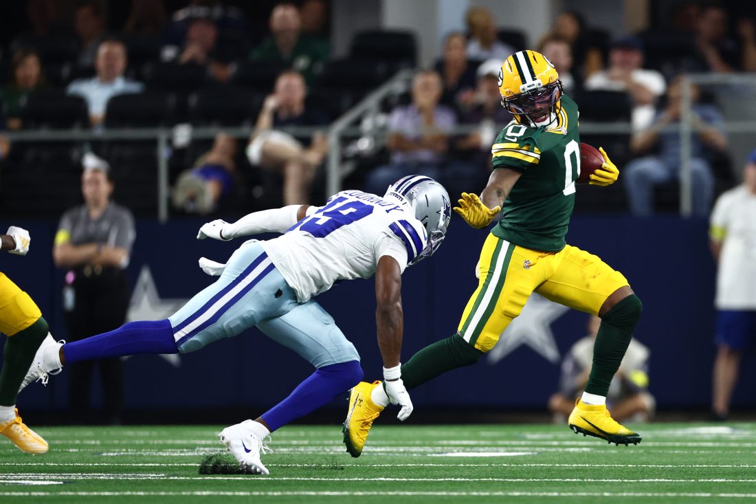 Sep 28, 2025; Arlington, Texas, USA; Green Bay Packers wide receiver Matthew Golden (0) runs against Dallas Cowboys wide receiver Ryan Flournoy (19) in the first quarter at AT&T Stadium. Mandatory Credit: Kevin Jairaj-Imagn Images