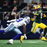 Sep 28, 2025; Arlington, Texas, USA; Green Bay Packers wide receiver Matthew Golden (0) runs against Dallas Cowboys wide receiver Ryan Flournoy (19) in the first quarter at AT&T Stadium. Mandatory Credit: Kevin Jairaj-Imagn Images