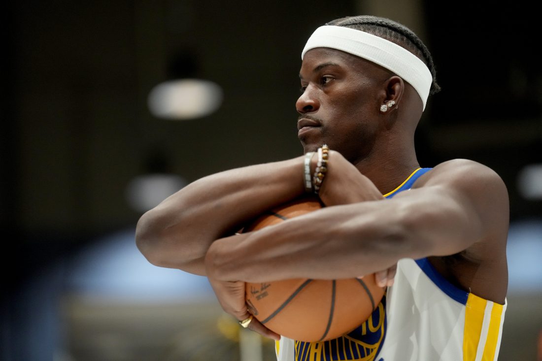Sep 29, 2025; San Francisco, CA, USA; Golden State Warriors forward Jimmy Butler III (10) holds onto the ball during Media Day at the Chase Center. Mandatory Credit: Cary Edmondson-Imagn Images