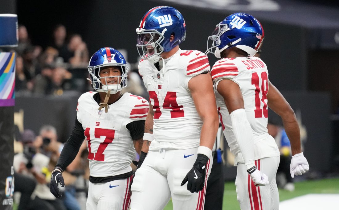 Oct 5, 2025; New Orleans, Louisiana, USA; New York Giants wide receiver Wan'Dale Robinson (17), New York Giants tight end Theo Johnson (84) and New York Giants wide receiver Darius Slayton (18) celebrate after a touchdown against the New Orleans Saints during the second quarter at Caesars Superdome. Mandatory Credit: Matthew Hinton-Imagn Images