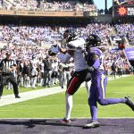 Oct 5, 2025; Baltimore, Maryland, USA; Houston Texans wide receiver Xavier Hutchinson (19) catches a touchdown pass past Baltimore Ravens cornerback T.J. Tampa (27) during the second quarter at M&T Bank Stadium. Mandatory Credit: Rafael Suanes-Imagn Images